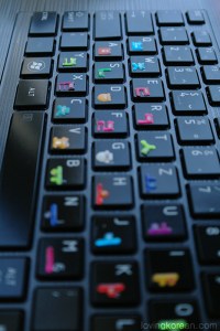 Cute Korean alphabet bear stickers on dark keyboard